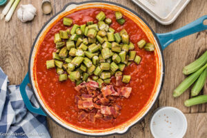 Step 6 how to make Okra with Tomatoes, Add the okra and bacon pieces back and cook.