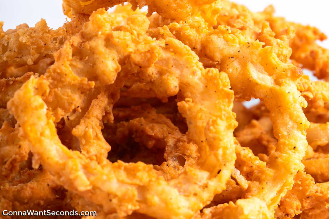 Crispy, golden homemade onion rings! Double-dipped in seasoned flour for the ultimate crunch! Easy, crave-worthy, and perfect for dipping. #onionrings #snacks Onion Rings close up