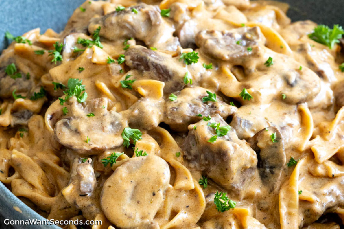 Cook up a cozy meal with one pot beef stroganoff. A fuss-free dish with steak, mushrooms, and creamy sauce, all in one pan. #onepanmeals #beefstroganoff one pot beef stroganoff with creamy sauce in a bowl