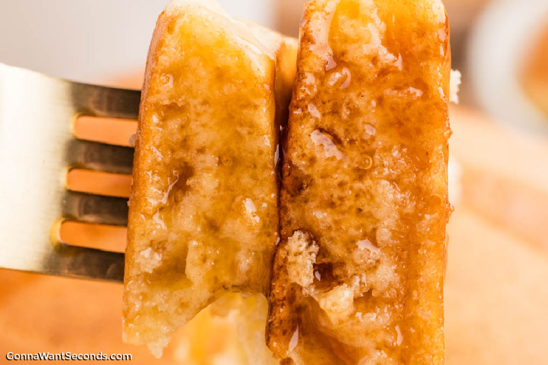 Our cream cheese pancakes are thick, fluffy, and irresistibly rich—like classic diner pancakes but with a luxurious twist. Perfect for lazy weekend mornings! #creamcheesepancakes #breakfast cream cheese pancakes on a fork close up