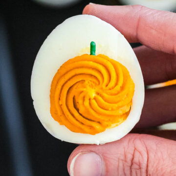 hand holding halloween deviled egg close up