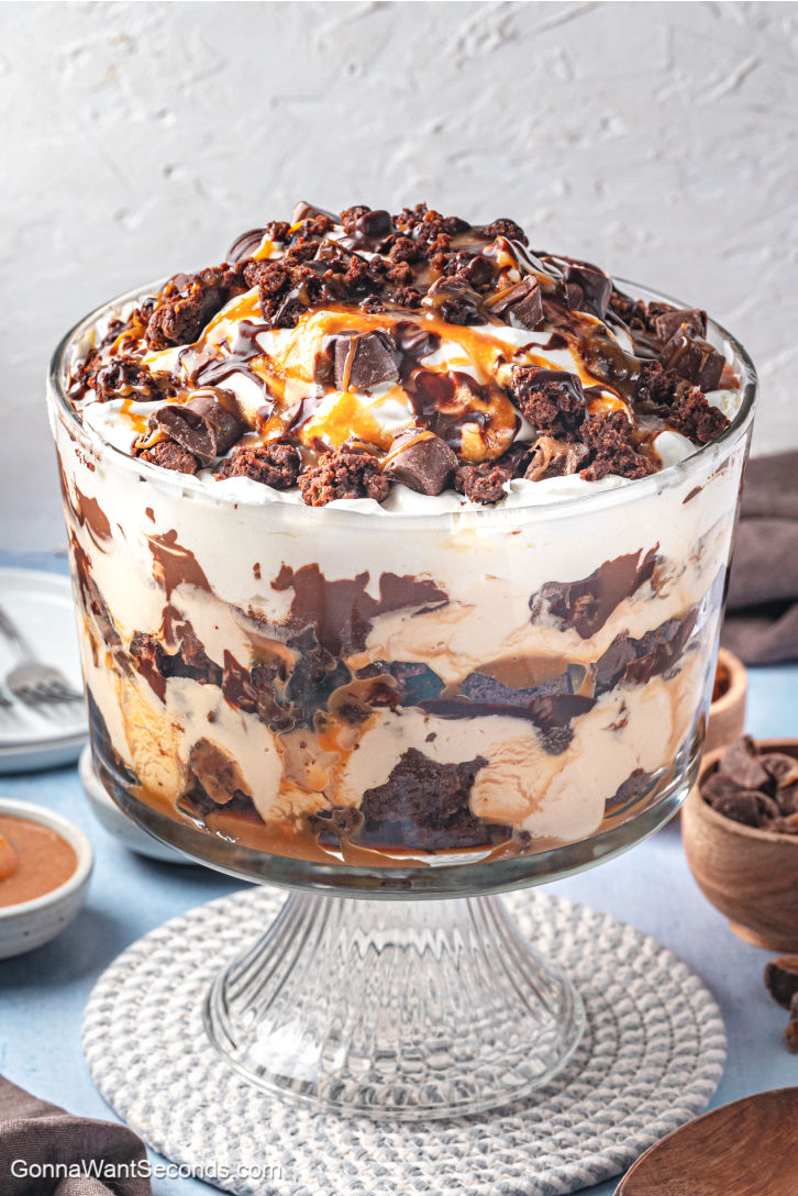 Rich layers of fudgy brownies, caramel mousse, whipped cream, and ganache make this Salted Caramel Brownie Trifle pure dessert bliss. #brownietrifle #trifle Salted Caramel Brownie Trifle with layers of fudgy brownies, caramel mousse, whipped cream, and ganache