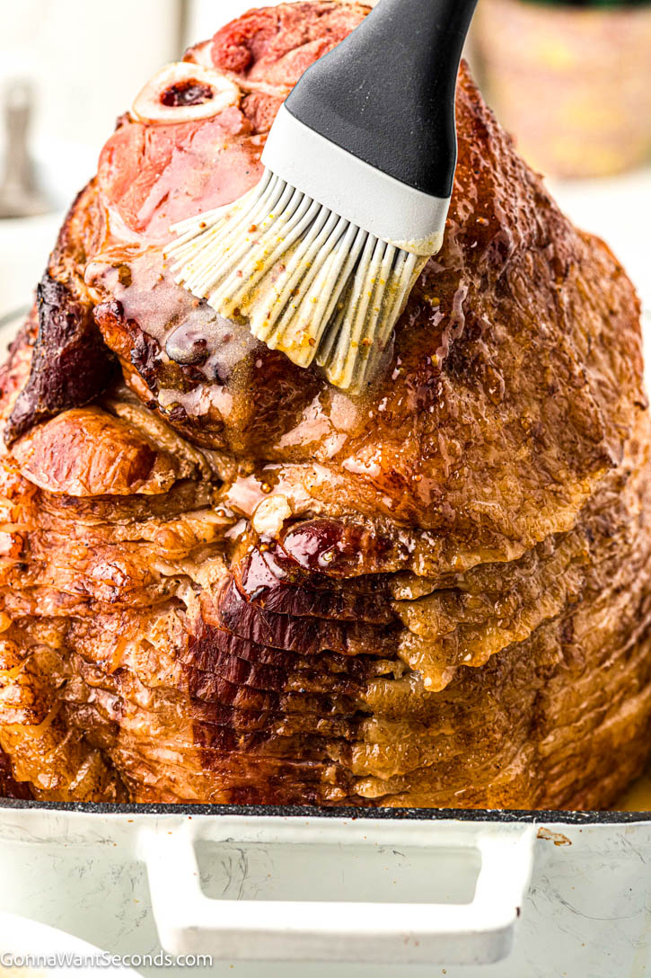 This holiday ham is juicy, tender, and beautifully caramelized with a sweet-savory ham glaze that shimmers like glass. It’s buttery, honey-kissed, and tangy #hamglaze #glaze Brushing ham glaze all over the ham
