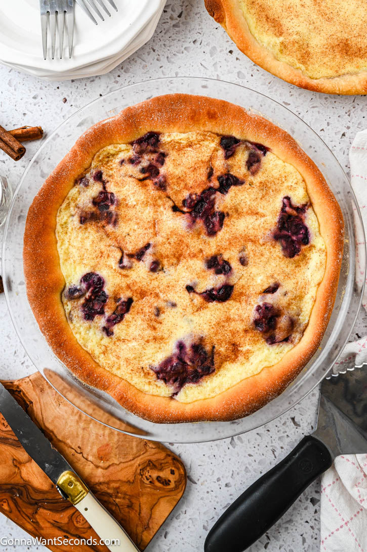 German Custard Kuchen has a tender, buttery crust and creamy vanilla custard topping—a simple, comforting old-fashioned favorite. #custardkuchen #kuchen whole kuchen top shot