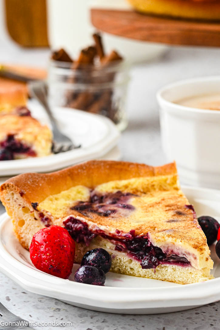 German Custard Kuchen has a tender, buttery crust and creamy vanilla custard topping—a simple, comforting old-fashioned favorite. #custardkuchen #kuchen a slice of German Custard Kuchen