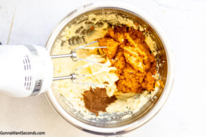 Step 3 how to make no bake pumpkin pie with cream cheese, Add pumpkin puree and pumpkin spice.