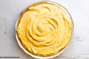 Step 7 how to make no bake pumpkin pie, Pour the mixture into the prepared crust.