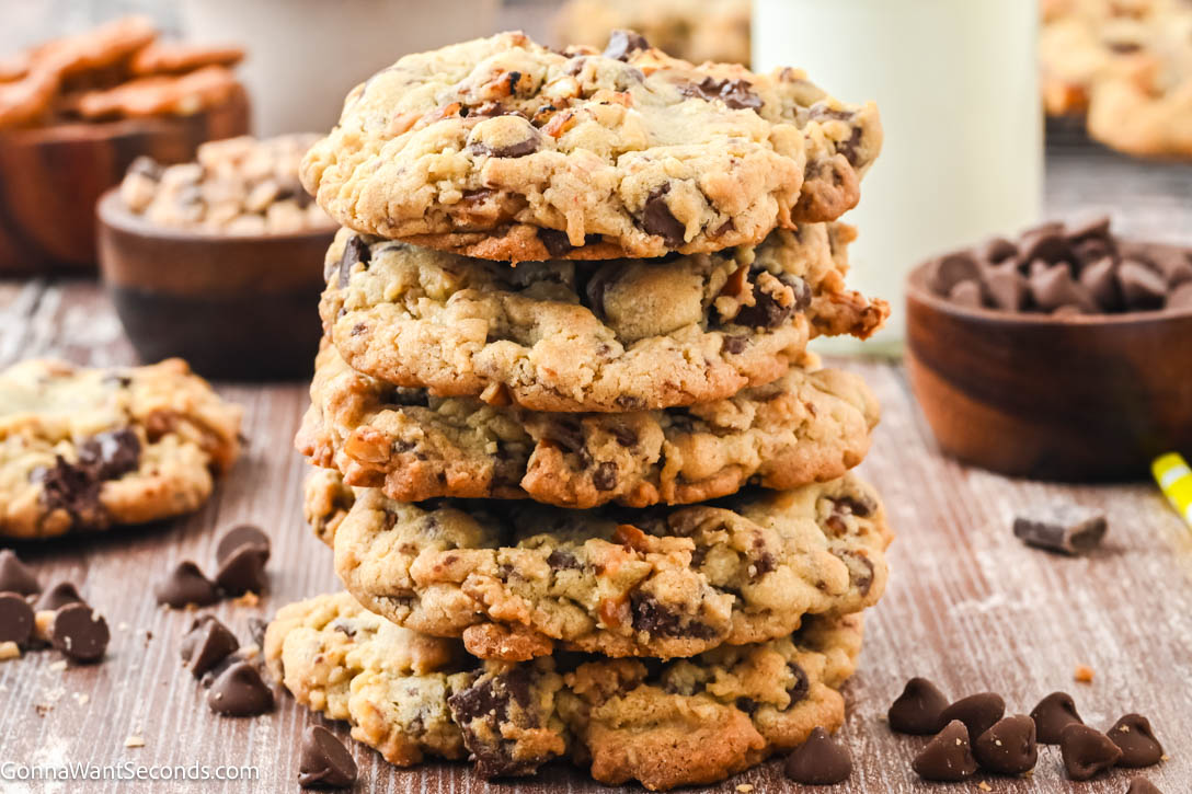 This sweet and salty Rockstar Cookie is loaded with milk chocolate chips, semi-sweet chunks, crunchy pretzels, buttery toffee bits, with sea salt on top. #rockstarcookies Rockstar Cookie stack on top of each other