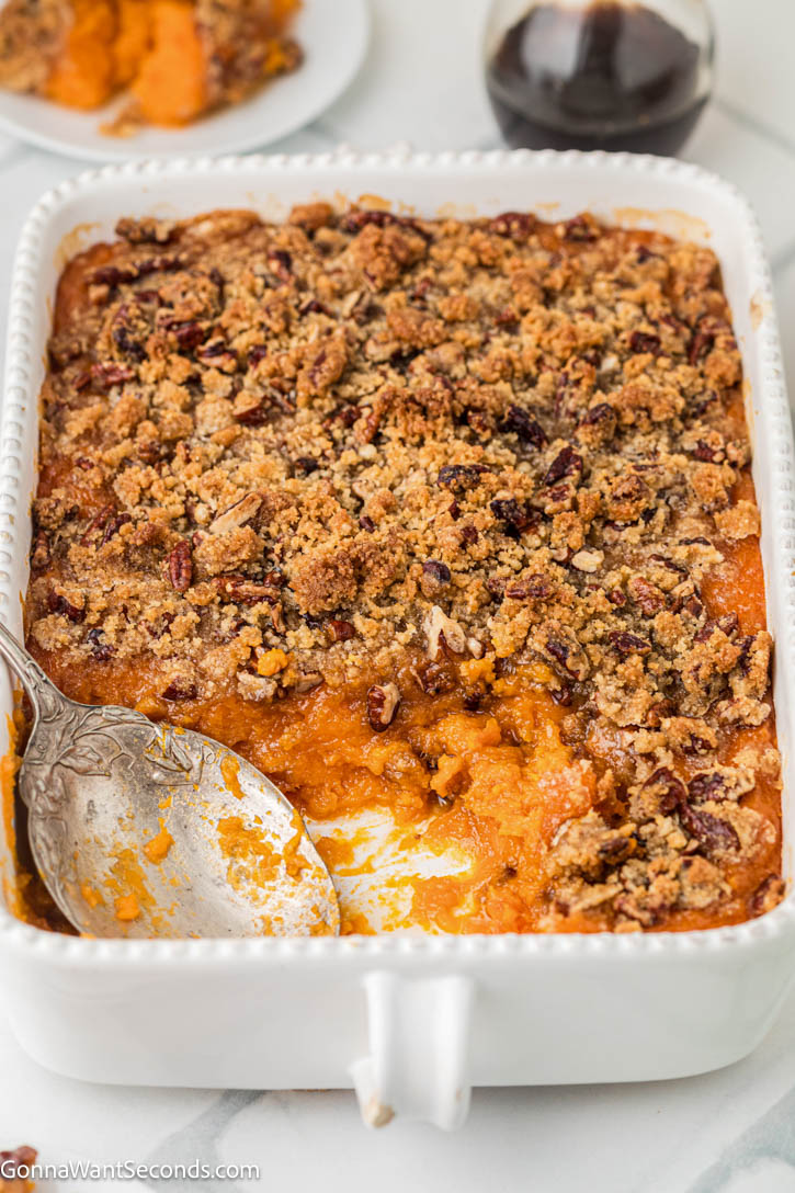 This Ruth’s Chris Sweet Potato Casserole has silky smooth sweet potatoes, with golden and crisp brown sugar–pecan topping. It's the best holiday side dish! #sweetpotatoes #sweetpotatocasserole Ruth’s Chris Sweet Potato Casserole with golden and crisp brown sugar–pecan topping