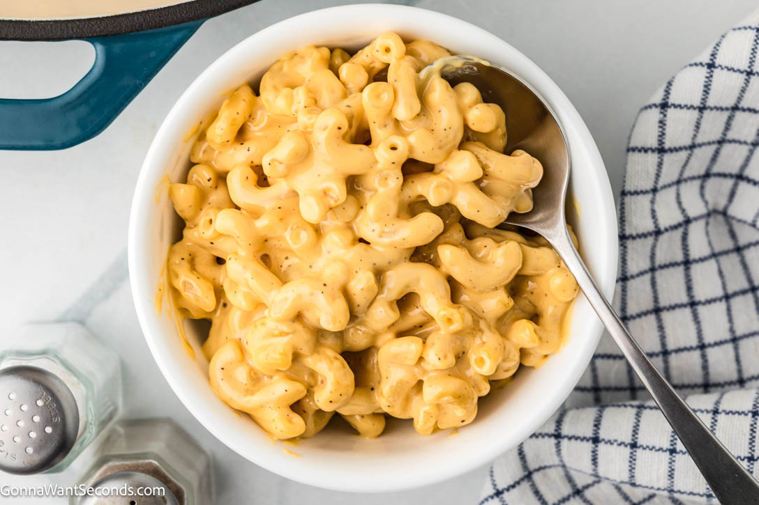 Ultra-creamy Velveeta Mac and Cheese made with milk, mustard, + a dash of Tabasco for brightness — a cozy, nostalgic classic everyone loves. #velveetamacandcheese #macandcheese velveeta mac and cheese in a bowl