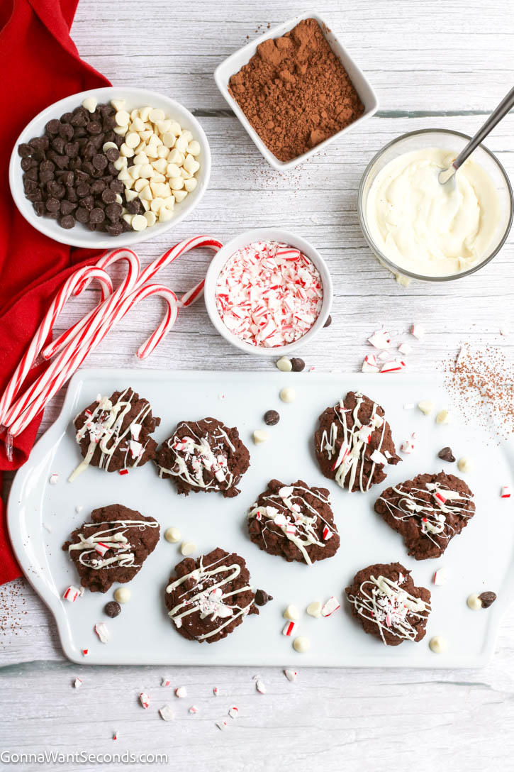 Chocolate Peppermint Cookies have fudgy double chocolate centers, smooth white chocolate dip, and peppermint crunch. Perfect for Christmas cookie tray. #chocolatecookies #peppermintcookies Chocolate Peppermint Cookies drizzled with white chocolate and crushed peppermint candies