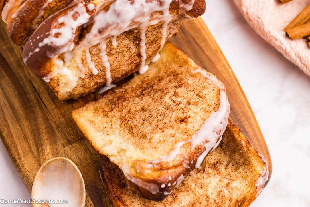 Soft, gooey cinnamon pull apart bread with buttery layers and a sweet powdered sugar glaze—perfect for brunches and holidays in a 9x5 loaf today! #cinnamonbread #pullapartbread cinnamon pull apart bread with sweet powdered sugar glaze dripping