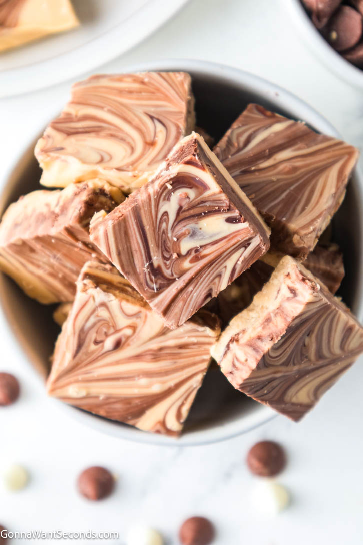 My Tiger Butter Fudge is rich, creamy peanut butter and chocolate swirled into pretty tiger stripes—easy to make, perfect for holiday trays and gifting. #tigerbutterfudge #peanutbutterchocolatefudge tiger butter fudge in a bowl