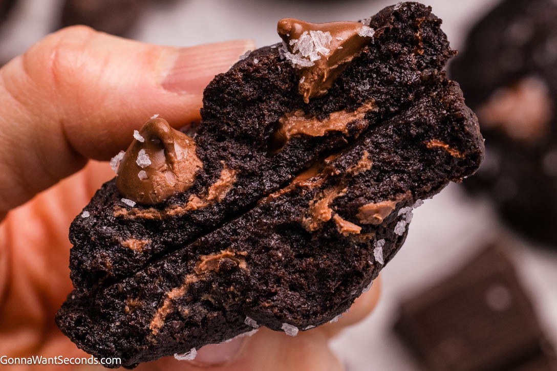 These Triple Chocolate Cookies are the ultimate indulgence—rich, fudgy, and packed with layers of chocolate in every bite. #chocolatecookies #triplechocolatecookies Triple Chocolate Cookies broken in half