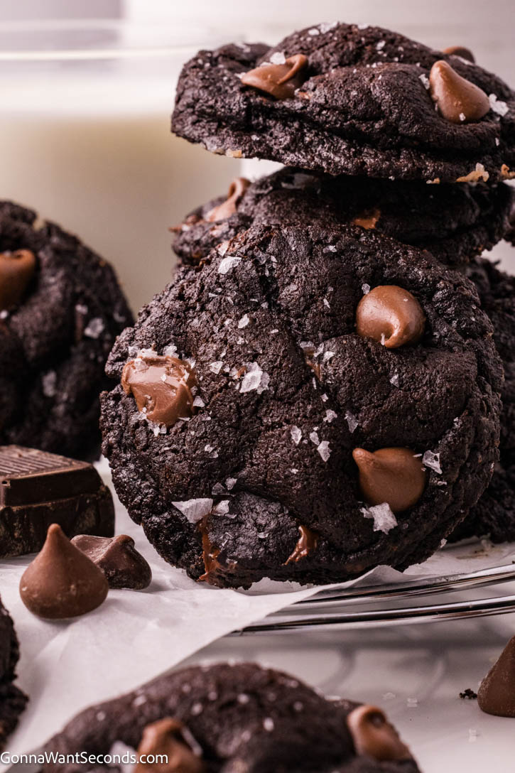 These Triple Chocolate Cookies are the ultimate indulgence—rich, fudgy, and packed with layers of chocolate in every bite. #chocolatecookies #triplechocolatecookies Triple Chocolate Cookies on a cooling rack