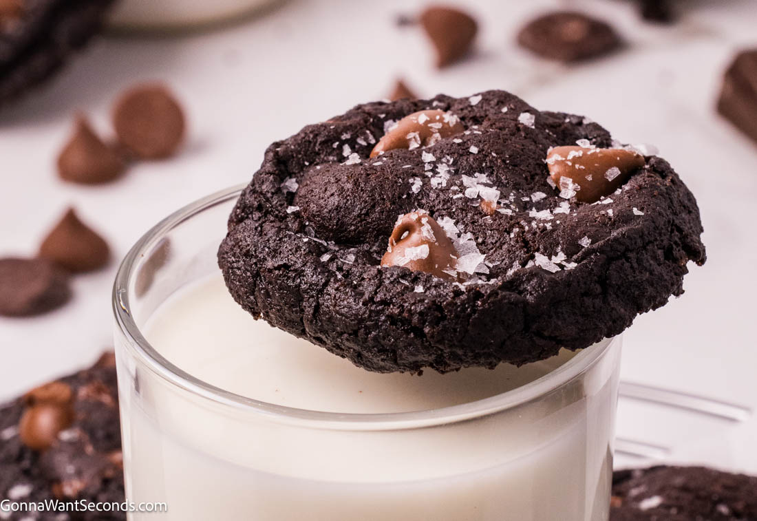 These Triple Chocolate Cookies are the ultimate indulgence—rich, fudgy, and packed with layers of chocolate in every bite. #chocolatecookies #triplechocolatecookies Triple Chocolate Cookies on top of a glass of milk