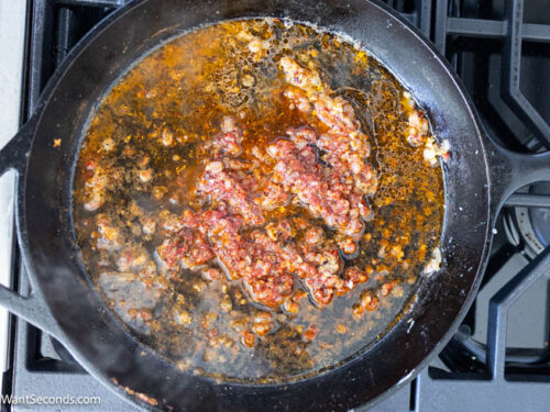 Step 4 how to make Marry Me Chicken Pasta, Add tomato paste, Italian seasoning, and flour to the skillet. Pour the wine and let it reduce by half.