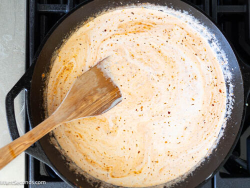 Step 5 how to make Marry Me Chicken Pasta, Remove from heat and whisk in the cream.