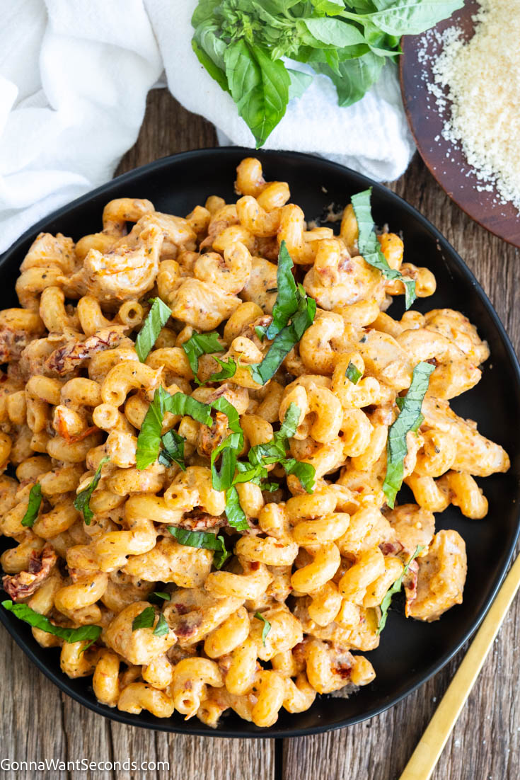 Marry me chicken pasta makes a creamy bold sauce that coats the pasta and tender chicken perfectly. It is a luscious meal that you can make in 30 minutes. #marrymechicken #chickenpasta Marry Me Chicken Pasta on a plate