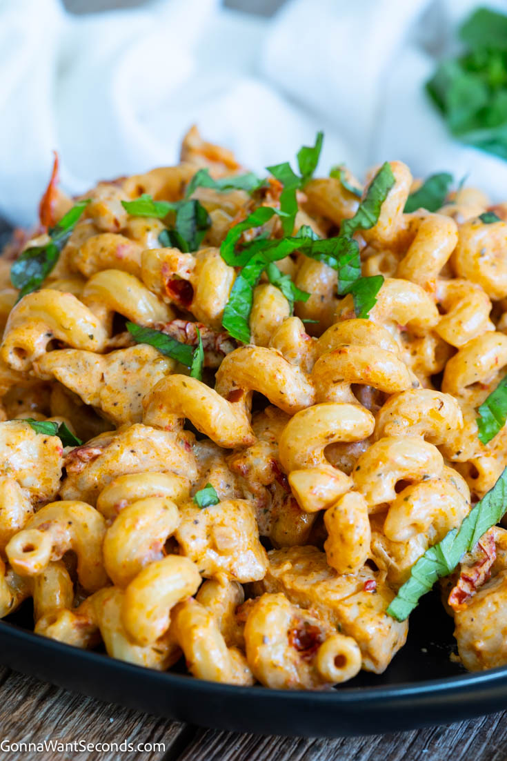 Marry me chicken pasta makes a creamy bold sauce that coats the pasta and tender chicken perfectly. It is a luscious meal that you can make in 30 minutes. #marrymechicken #chickenpasta Marry Me Chicken Pasta on a plate