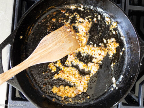 Step 3 how to make Marry Me Chicken Pasta, Saute the aromatics and red pepper flakes using oil from sun-dried tomatoes.