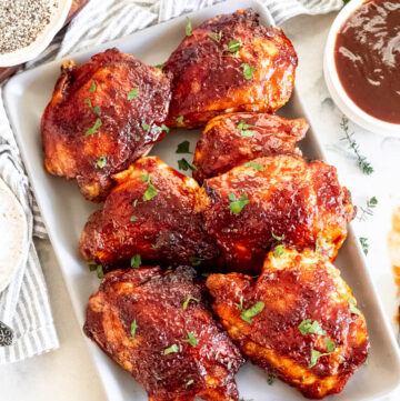 Oven Baked BBQ Chicken Thighs on a serving platter