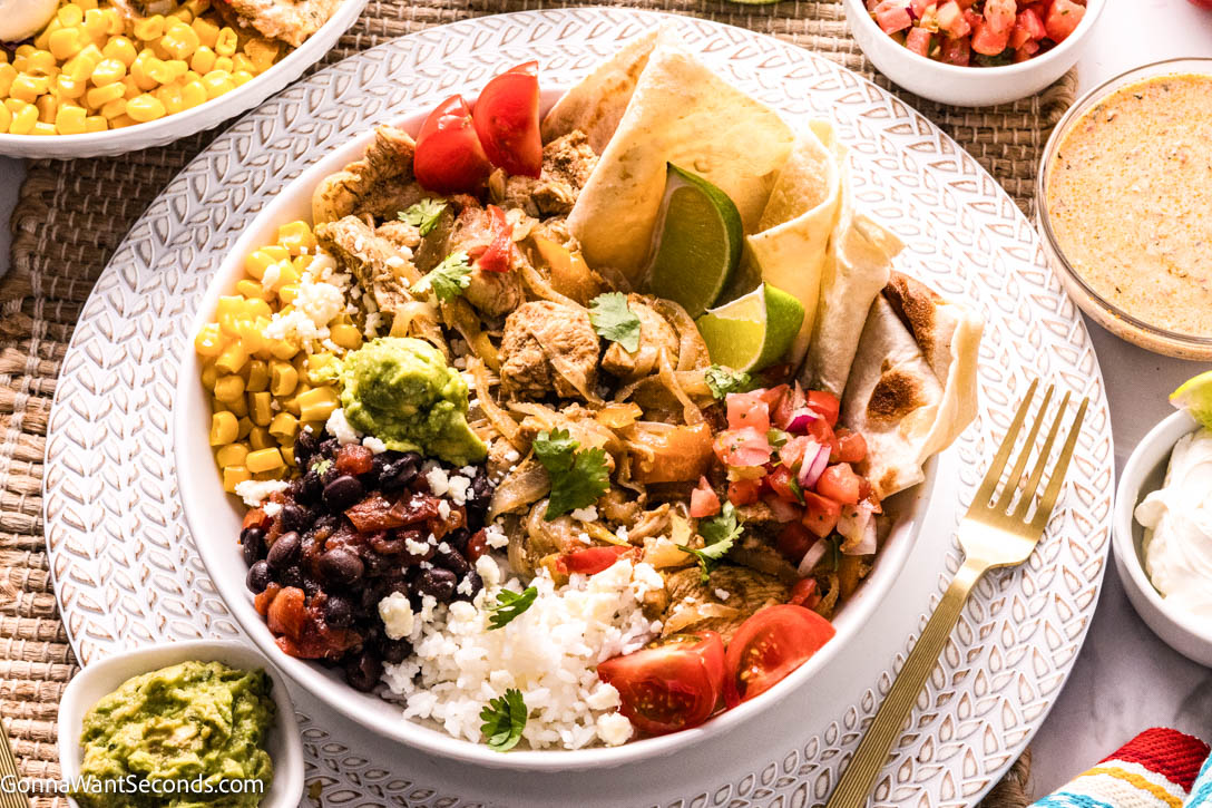Chicken Fajita Bowls with lime wedges on the side
