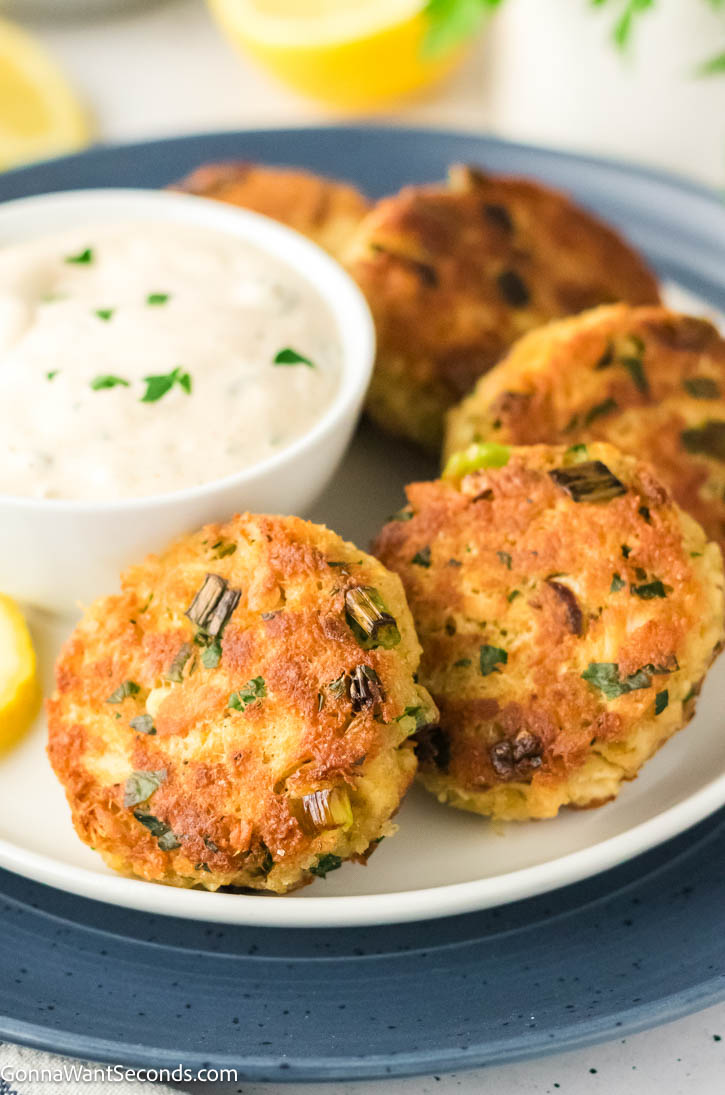 These crispy tuna cakes are easy, never mushy, and won’t fall apart. Made with simple ingredients, they’re perfect for a quick weeknight dinner. #tunacakes #tunapatties tuna cakes with lemon caper sauce on a plate