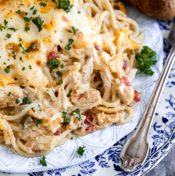 Best Creamy Chicken Spaghetti with bread on the side on a plate