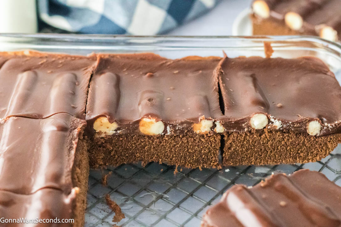 Slices of bumpy cake showing the buttercream bump inside topped with frosting