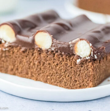 A slice of bumpy cake showing the buttercream bump inside