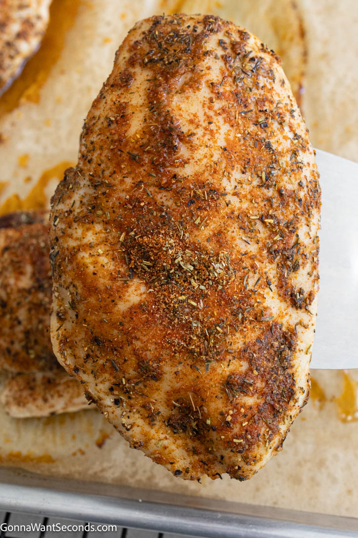 Learn how to make baked boneless chicken breast that’s juicy, tender, and never dry. This easy 425°F method works every time—perfect for weeknight dinners. #chickenbreast #bakedchickenbreast baked boneless chicken breast on a baking sheet