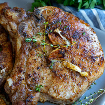 pan seared pork chops on a plate