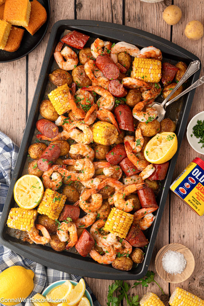 This Sheet Pan Shrimp Boil Recipe is loaded with juicy shrimp, smoky sausage, corn, and potatoes roasted in seasoned garlic butter for an easy one-pan dinner. #shrimpboil #sheetpanrecipes Sheet Pan Shrimp Boil top shot