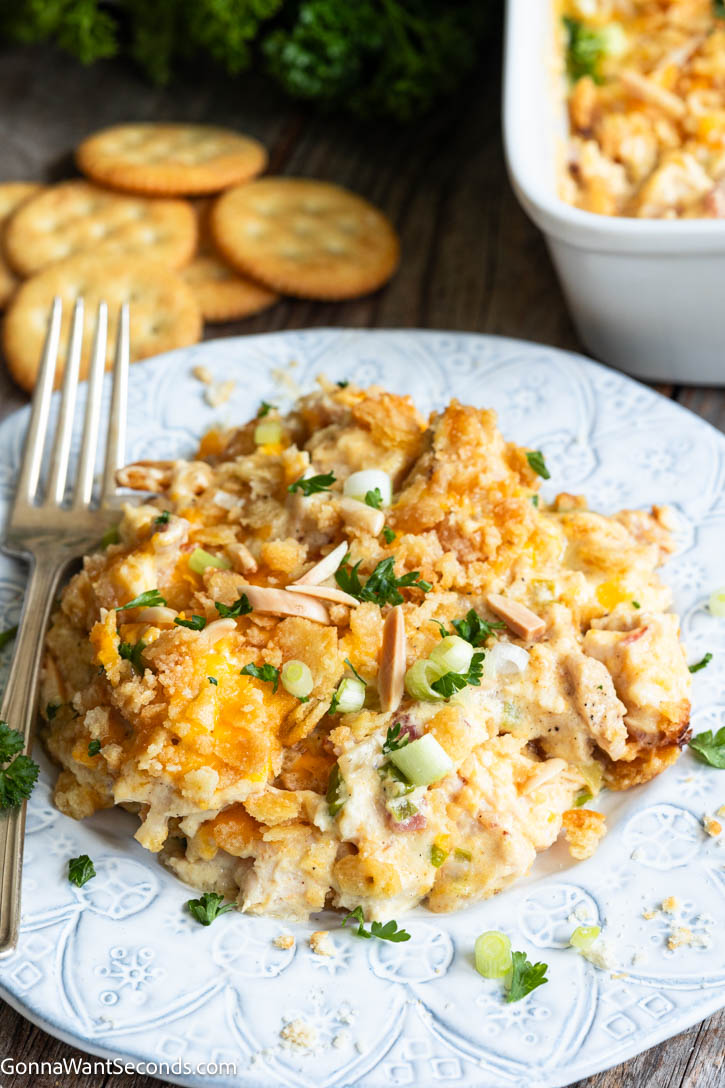 Neiman Marcus Chicken Casserole is creamy, cheesy, and loaded with tender chicken, bacon, and a buttery Ritz cracker topping. #chickencasserole #neimanmarcus Neiman Marcus Chicken Casserole on a plate
