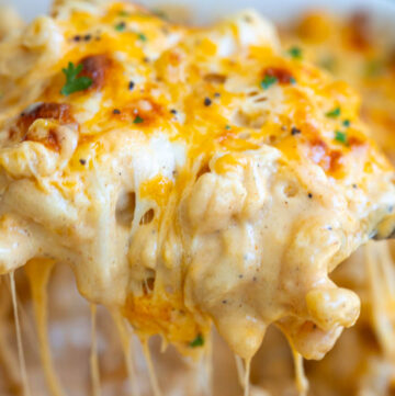 Scooping Tini’s Mac and Cheese with dripping cheese strings